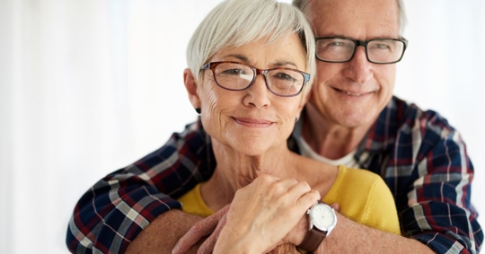 Older couple embracing and feeling confident their will is in order after working with Jerimy Kirschner & Associates